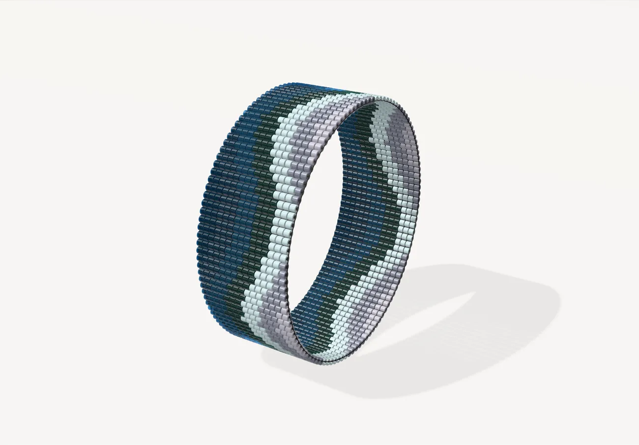 Ocean wave as a closed loom bangle in transparent and luster blue Delicas